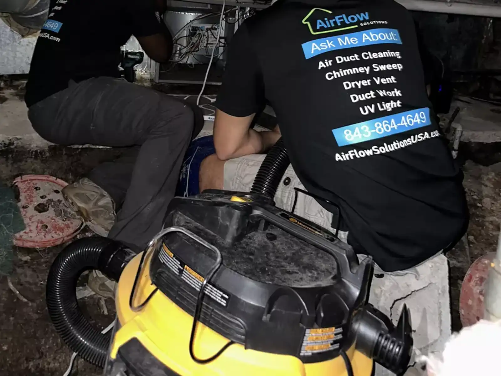 AirFlow Solutions technicians working on ductwork
