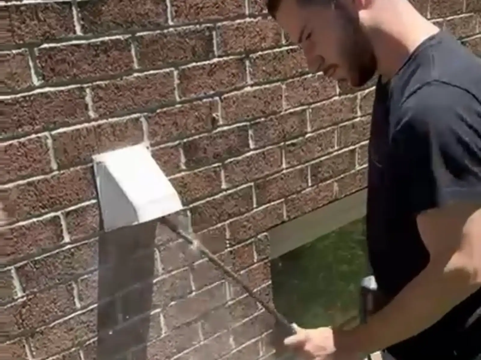 Technician cleaning a dryer vent